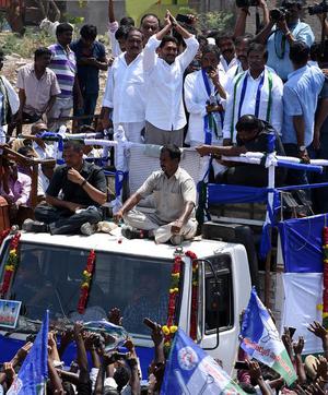 Y.S. Jagan Mohan Reddy greets the people at the public meeting at Orvakal in Kurnool on Monday.