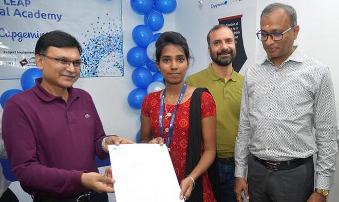 Ashwin Yardi, CEO, Capgemini, handing over the appoinment order to a student on Tuesday.