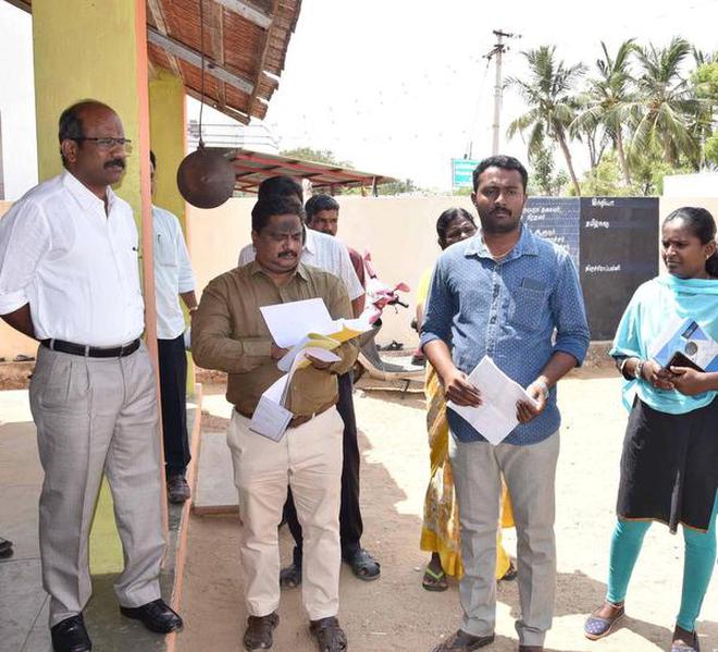 Collector S. Sivarasu inspecting a polling station at Olaiyur near Tiruchi on Saturday.