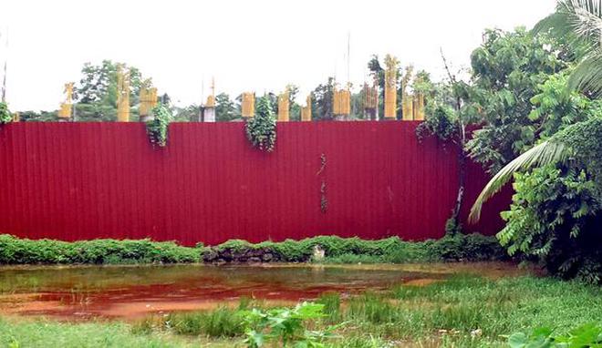 Violation?: A building coming up on a reclaimed wet land at Iringalore in Kozhikode district.