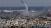 An army helicopter drops water at the scene of Tuesday's massive explosion that hit the seaport of Beirut, Lebanon, Wednesday, Aug. 5, 2020.