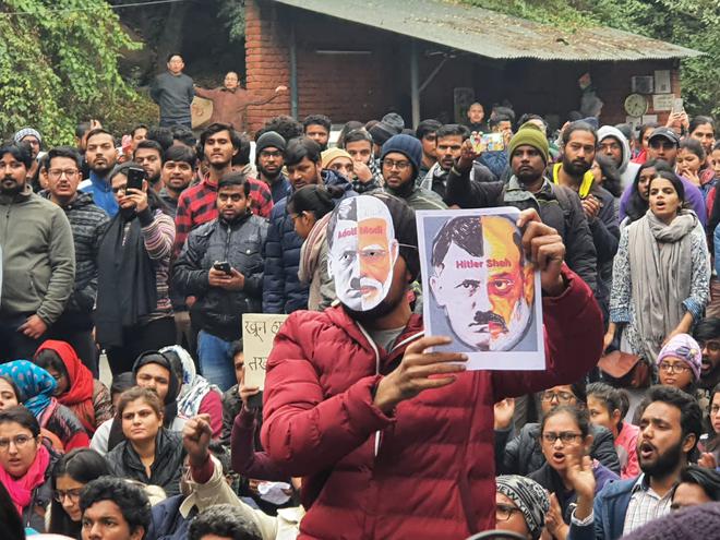 JNU students gathered near the Main gate during a protest demonstration against the attacks in New Delhi on Monday