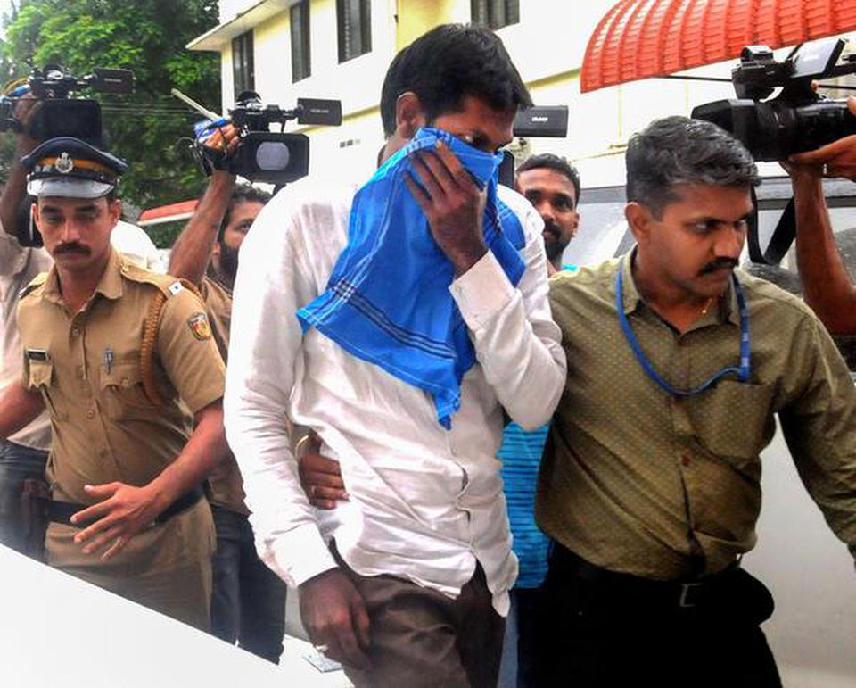 Mohammed Azarudeen being produced before the NIA special court in Kochi on Thursday.