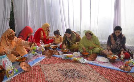 Changing times: People eating from separate vessels at a wedding in Srinagar.