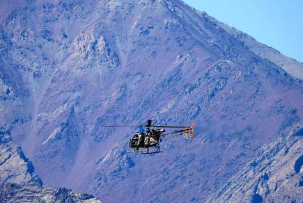An IAF helicopter flies over a mountain range in Leh on September 10, 2020.