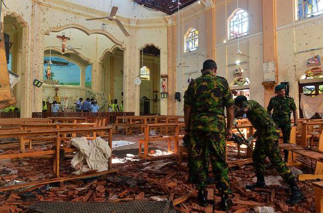 “The attacks in Sri Lanka underline the many cracks in the concept of a global War on Terror.” Security personnel inspect the interior of St. Sebastian's Church in Negombo, Sri Lanka, on April 22, a day after a bomb blast in the church. AFP