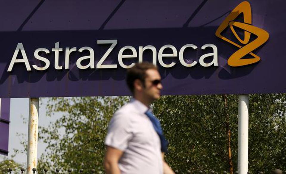 A man walks past a sign at an AstraZeneca site in Macclesfield, central England May 19, 2014. File