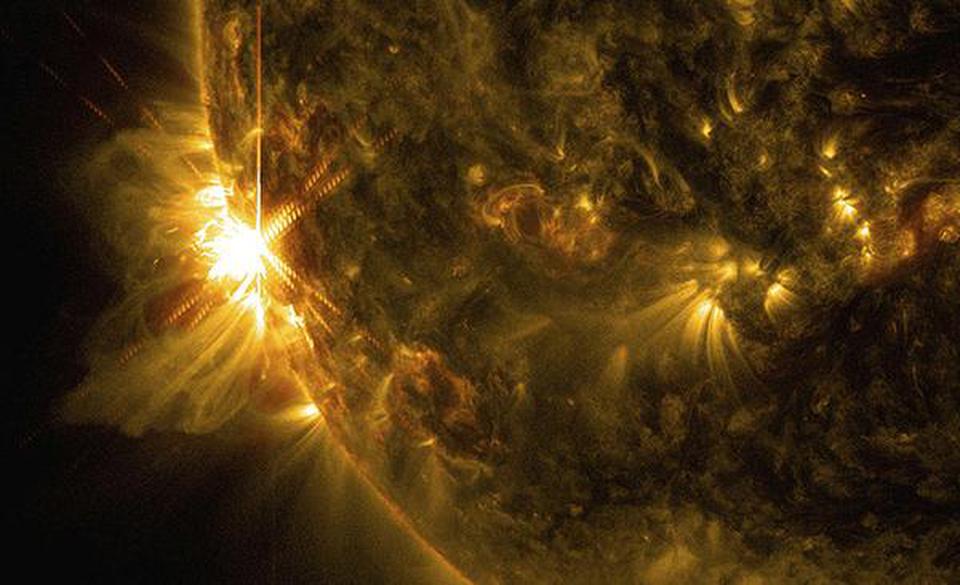 A solar flare bursts off the Sun in this image captured by NASA's Solar Dynamics Observatory .