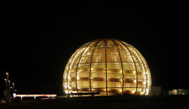 The globe of the European Organization for Nuclear Research, CERN, is illuminated outside Geneva, Switzerland