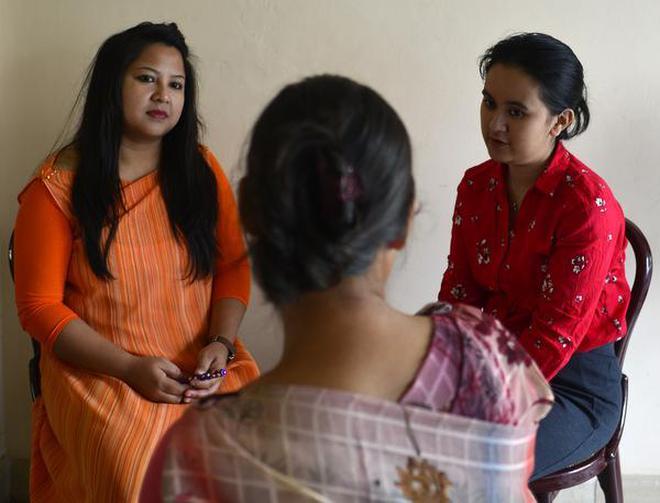 Counsellors talk to a survivor at a Dilaasa support centre in Shillong.